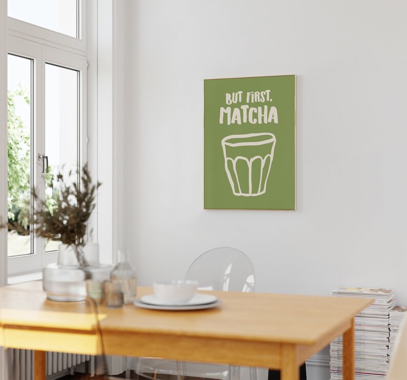 May include: A green and white poster with the text "But first, Matcha" and a drawing of a cup of matcha.