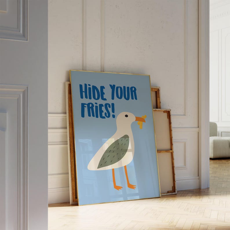 May include: A blue and white poster with a cartoon seagull holding a french fry in its beak. The poster says "Hide Your Fries!"
