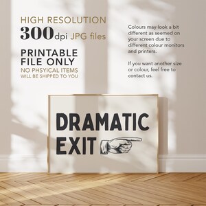 May include: A printable digital download of a sign that says "Dramatic Exit" with a pointing hand graphic. The sign is framed and displayed on a wooden floor.