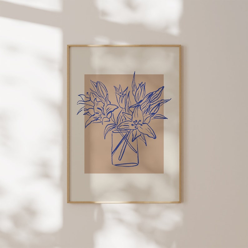 May include: A framed print of a blue line drawing of a bouquet of flowers in a glass vase on a beige background.