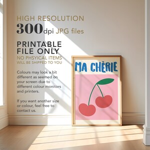 May include: Printable digital download of a pink poster with the text "MA CHERIE" in blue and a green stem with two red cherries on it.