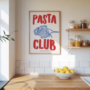 May include: A white poster with a red and blue illustration of a fork with pasta on it. The poster has the text "PASTA CLUB" in red letters.