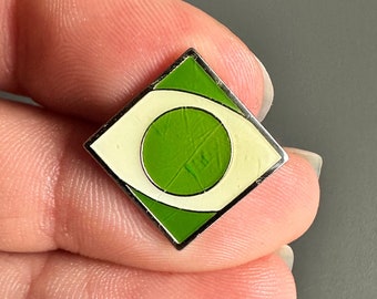 Retro 1990s green graphic design geometric shapes logo symbol enamel lapel pin badge brooch