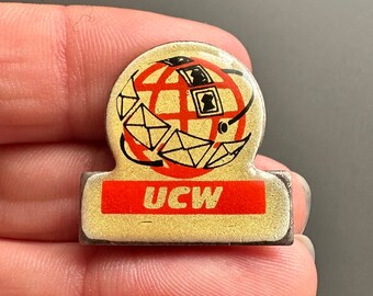 UCW global logistics shipping brand promo advertising enamel lapel pin badge brooch
