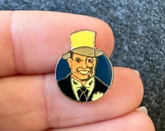 Man wearing yellow top hat enamel lapel pin badge brooch Police Charity