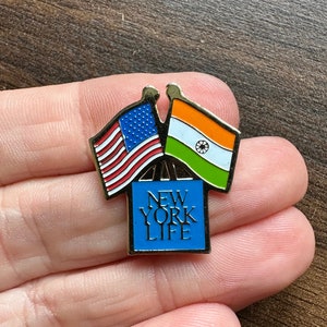 USA and India flags New York Life crossed friendship enamel lapel pin badge brooch
