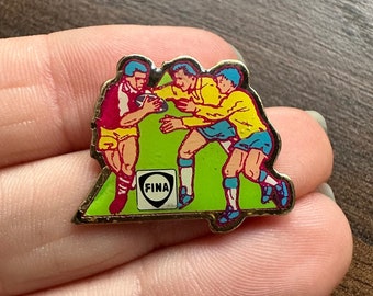 FINA fútbol americano Rugby publicidad esmalte solapa pin broche con insignia