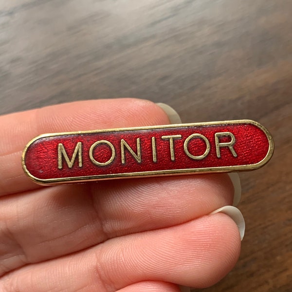 insigne d'épinglette de moniteur en émail rouge vintage