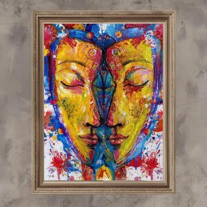 May include: A framed abstract painting featuring two faces merged together. The artwork uses vibrant colors, including yellow, blue, red, and pink. The faces have closed eyes and are set against a white background with colorful paint splatters.