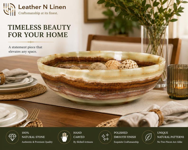 The green onyx bowl sits on a wooden dining table filled with decorative woven spheres, surrounded by tableware, a candle, and a vase with greenery in a home setting.