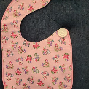 Flowers on Pink Backdrop Bib