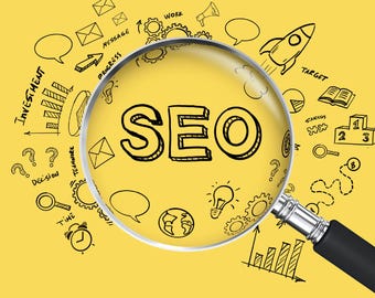 May include: A book cover with the title "WINNING the GAME" in black text on a yellow background. The word "SEO" is magnified by a magnifying glass. The author's name, Marie Griffin, is at the bottom.