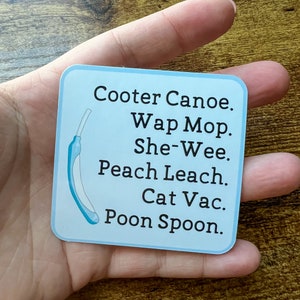 May include: A blue and white sticker with the text "Cooter Canoe. Wap Mop. She-Wee. Peach Leach. Cat Vac. Poon Spoon."