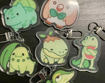 Pokemon Grass Type acrylic keychains. Chikorita, Bulbasaur, Snivy, Rowlet, Turtwig, Treecko.