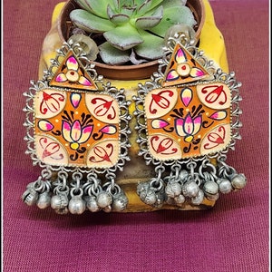 Handpainted silver look alike earrings in orange