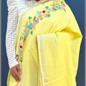 Linen by Linen saree in Golden Yellow with Silver Zari border - Handmade French knot floral embroidery
