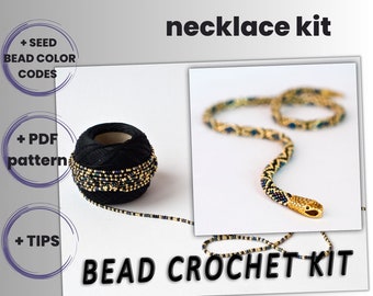 May include: A bead crochet necklace kit in English, featuring a black ball of thread with gold and blue beads, a finished necklace in the shape of a snake, and instructions for making the necklace.