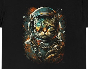 May include: A black t-shirt with a graphic of a cat wearing an astronaut helmet and goggles. The cat is looking to the right. The background is a dark blue with stars and planets.