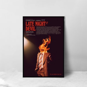 May include: A movie poster for the film "Late Night with the Devil" featuring a man in a suit with his head on fire. The poster is black with red text and the tagline "Do not adjust your set."