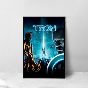 May include: A black framed poster featuring a blue and orange Tron: Legacy movie poster. The poster includes the text "TRON LEGACY" and two characters from the film.