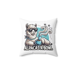May include: White square pillow featuring a cartoon alpaca wearing sunglasses and a bandana, holding a bong. The text "ALPACAS A BOWL" is printed below the alpaca. The alpaca is set against a blue circle with marijuana leaves.
