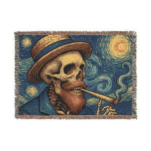 May include: Woven throw blanket featuring a skeleton in a hat and coat, smoking a cigar, set against a starry night sky. The design is reminiscent of a famous painting, with a blue, yellow, and brown color palette.