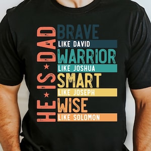 May include: A black t-shirt with a colorful graphic design that reads "He is Dad - Brave like David, Warrior like Joshua, Smart like Joseph, Wise like Solomon".