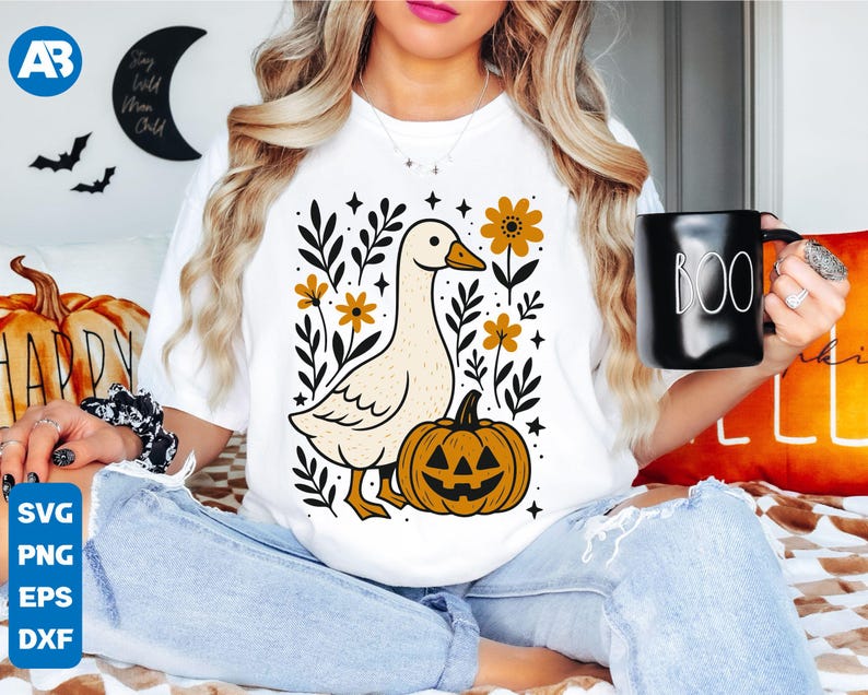 May include: White t-shirt featuring a cartoon goose, a jack-o'-lantern, and floral elements. The design includes the text "Stay Wild Moon Child" and "Boo" on a black mug. The image also shows SVG, PNG, EPS, and DXF file formats.