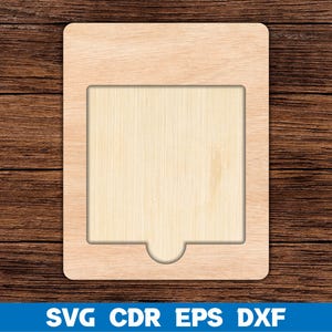 May include: A wooden cutout frame with a rectangular opening in the centre. The frame is light brown and has a smooth surface.