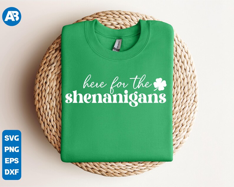 May include: Green sweatshirt with white text that says "Here for the shenanigans" and a white shamrock.