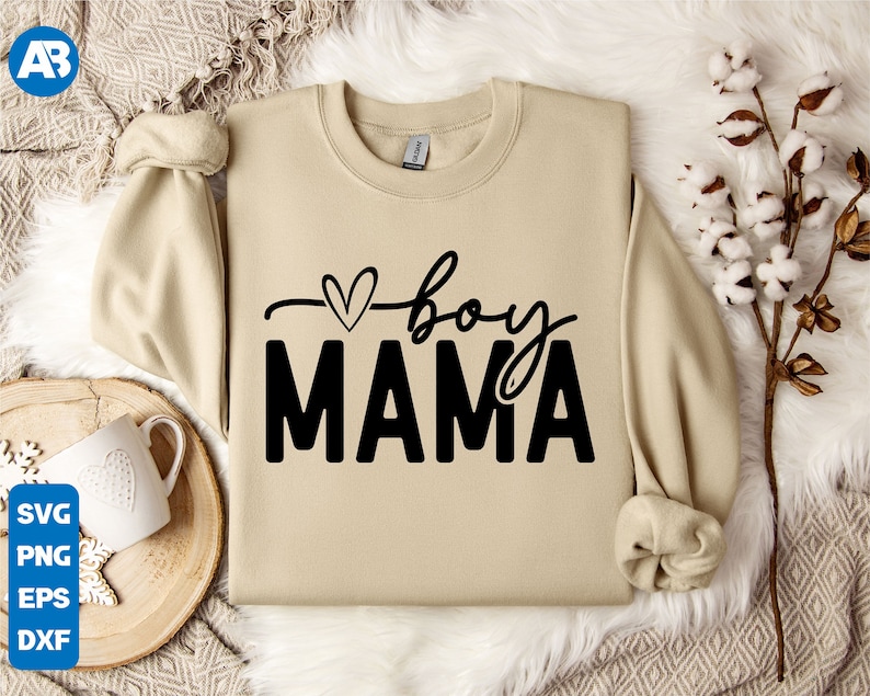 May include: A beige sweatshirt with a black graphic that says "boy mama" with a small heart above the word "boy".