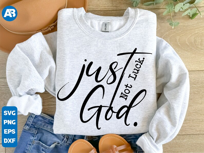 May include: A gray sweatshirt with the text "just God. Not Luck." in black cursive lettering.