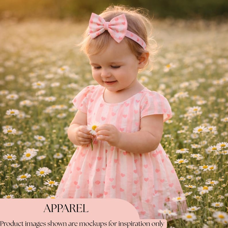 May include: A young child in a pink heart-patterned dress and bow headband, holding a daisy in a field of white flowers. The image includes the word "APPAREL" at the bottom. The dress has a vertical stripe design.