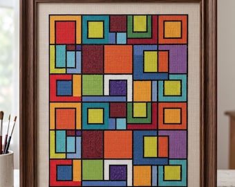 May include: A framed, colorful geometric needlepoint artwork. The design features a grid of squares and rectangles in various colors, including red, orange, yellow, green, blue, and purple, outlined in black. The frame is made of dark brown wood.