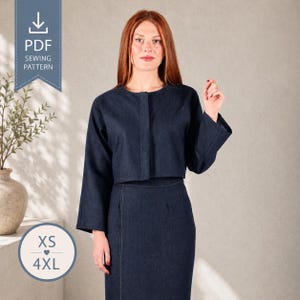 May include: A dark blue denim two-piece set consisting of a cropped long-sleeve jacket with a concealed front closure and a matching high-waisted skirt. The image includes a PDF sewing pattern icon and size range text from XS to 4XL.