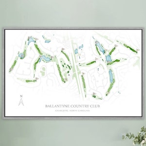 May include: A framed print of a golf course map with green fairways and blue water hazards. The map is titled "Ballantyne Country Club, Charlotte, North Carolina".