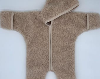 A boiled wool jumpsuit made from 100% Merino wool from Europe. Lambswool pile in a teddy-look.