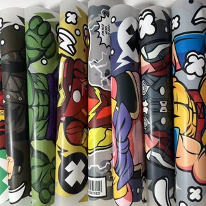 May include: A set of six colorful vinyl stickers featuring various cartoon characters. The stickers include a green Hulk, a red Iron Man, a yellow and red Flash, a purple and pink character, a black and red character, and a blue and yellow character. The stickers have a glossy finish and are perfect for adding a pop of color to laptops, water bottles, or other surfaces.
