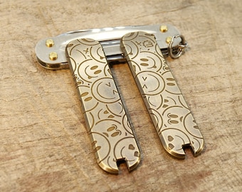 58 mm brass handle scales, scales smileys lasered - SAK MOD PARTS, sakmodparts