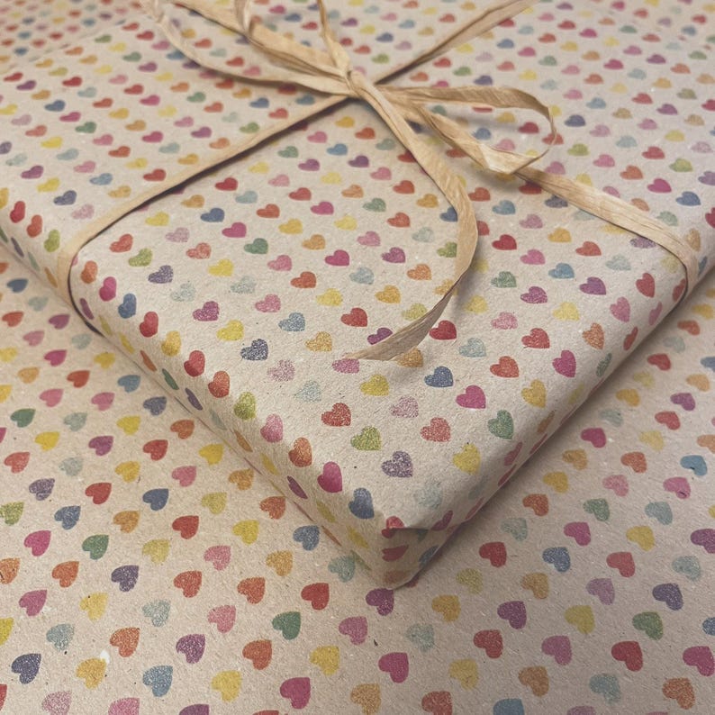 Recycled kraft wrapping paper with soft understated heart pattern, printed with vegetable inks