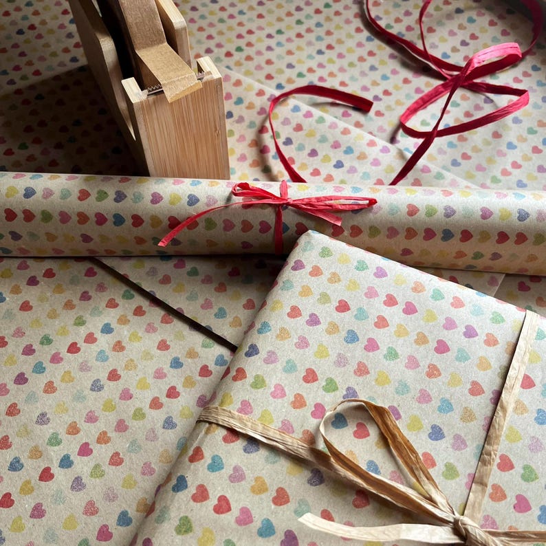Recycled kraft wrapping paper with subtle heart pattern in soft colours
