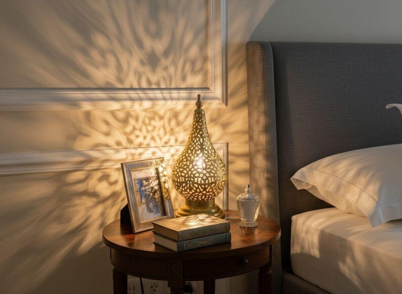Handmade Moroccan brass lamp with intricate patterns, perfect for vintage bedside decor.