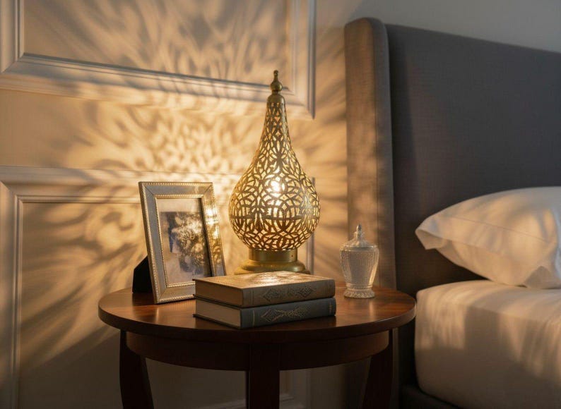 Antique brass table lamp handcrafted in Morocco, adds a warm glow to any room.