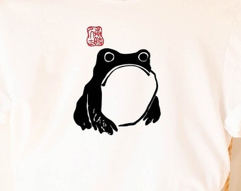 感動しないカエル。ユニセックスTシャツ、松本宝治によるヴィンテージ