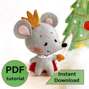 May include: A grey felt mouse wearing a gold crown and red cape, holding a sword. A green Christmas tree is in the background. The image also includes the text "PDF tutorial" and "Instant Download".