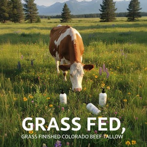 May include: A brown and white cow grazes in a field of wildflowers. Three white bottles with black pumps are in the foreground. The text "GRASS FED, GRASS FINISHED COLORADO BEEF TALLOW" is at the bottom of the image.