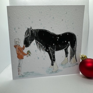 Una comarca para Navidad, tarjeta de felicitación de invierno con caballos pesados