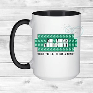 May include: White ceramic mug with a black handle and interior. The mug features a green and white design resembling a game board with the phrase "G F*CK Y*RS LF" and the text "WOULD YOU LIKE TO BUY A VOWEL?"