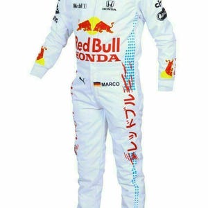 May include: White racing suit with Red Bull and Honda logos. Features sponsor logos, red and blue accents, and Japanese text. Includes the name "MARCO" and a German flag patch.