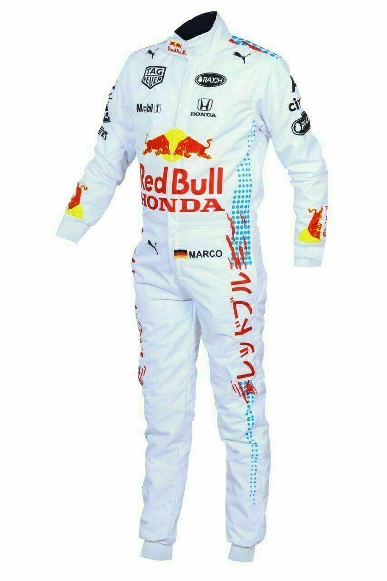 May include: White racing suit with Red Bull and Honda logos. Features sponsor logos, red and blue accents, and Japanese text. Includes the name "MARCO" and a German flag patch.